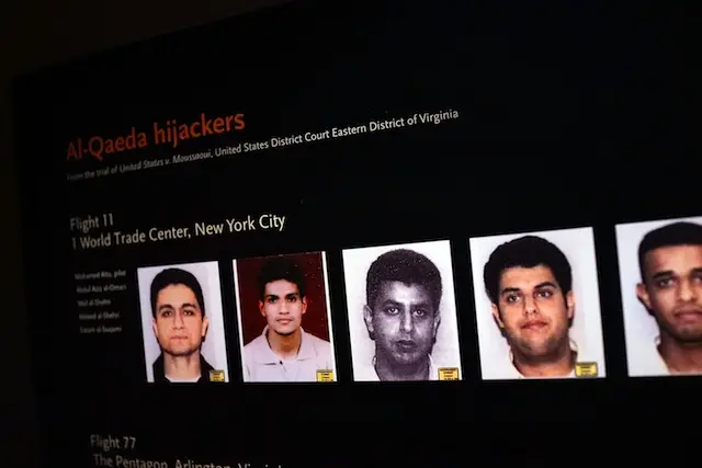 Pictures of some of the September 11 hijackers are viewed during a preview of the National September 11 Memorial Museum on May 14, 2014 in New York City